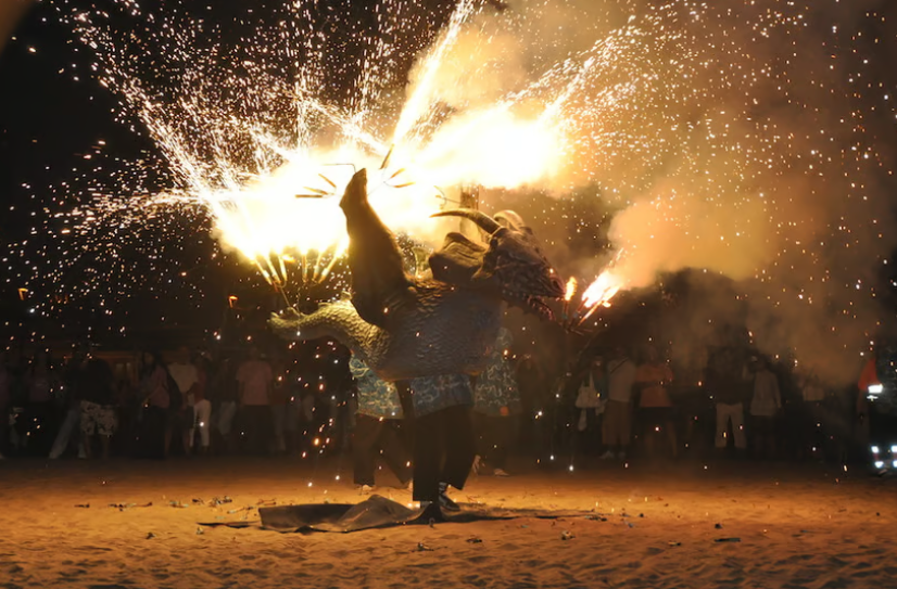 Fireworks and sparks lighting up San Juan night on the beach